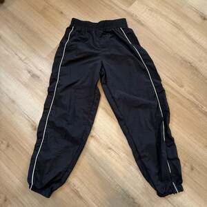Vintage NFL Ultra Game Black Nylon Track Pants Size Small